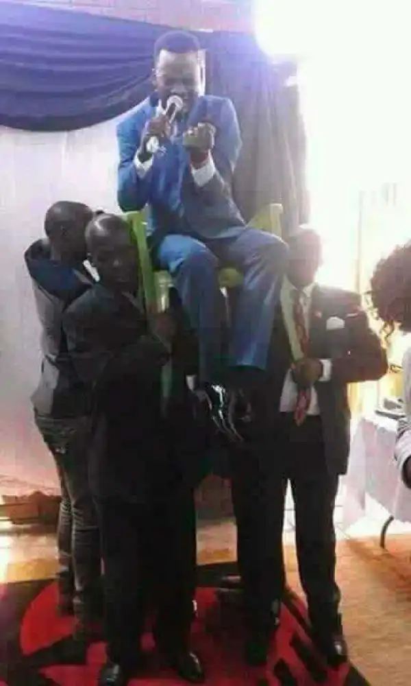 Church Members Carry Their Pastor On A Chair During Deliverance Session  { See Graphic Photo}